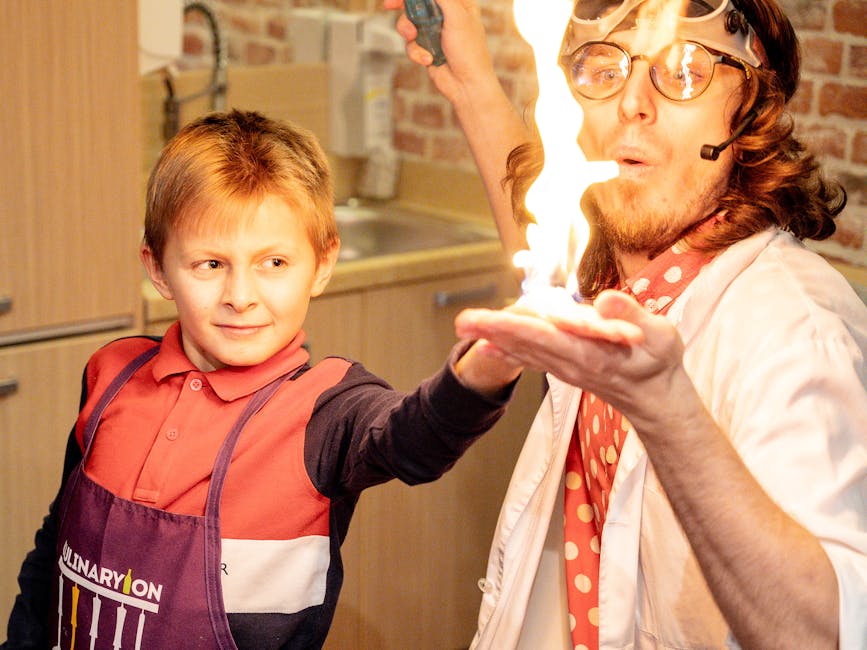 Esperimento chimico con fuoco: un bambino osserva uno scienziato durante una lezione di chimica didattica per esami equivalenti