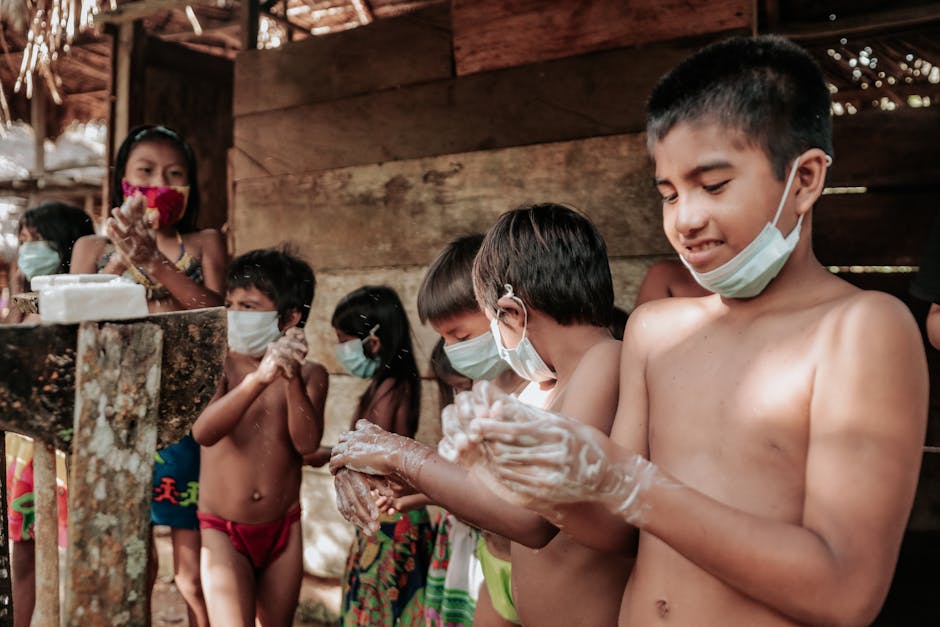 Bambini si lavano le mani con sapone e mascherine: prevenzione e igiene per un ambiente scolastico sicuro e contrasto al bullismo