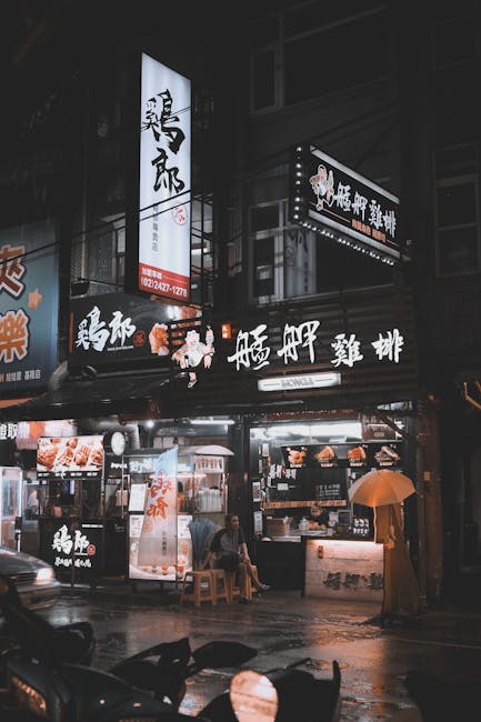 Ristorante notturno a Taiwan: insegne luminose e atmosfera unica che riflettono l'autenticità e la ricchezza culturale del luogo.