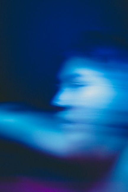 Interpretazione astratta della musica: immagine sfocata blu che evoca ritmo e vibrazioni sonore, perfetta per articolo sulle sfumature musicali.