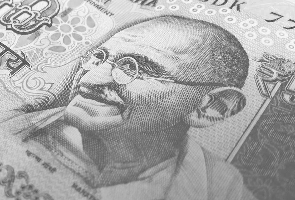 Rupia indiana con ritratto di Gandhi: implicazioni per flussi di cassa e ammortamento nelle imprese indiane e internazionali.