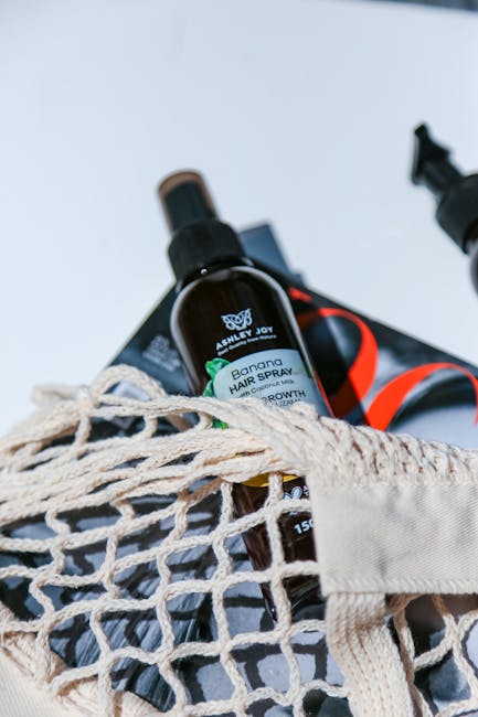 Spray per capelli alla banana Ashley Joy in borsa di rete, soluzione naturale per benessere e cura dei capelli quotidiana.