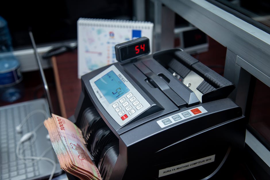 Contatore di banconote Premax che visualizza il numero 54, possibile riferimento al numero di assenze comunicate al SIDI tramite registro elettronico.