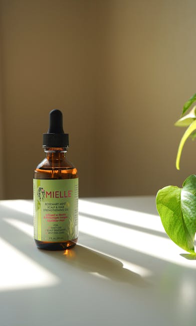 Olio fortificante per cuoio capelluto e capelli Mielle Rosemary Mint, essenziale per la cura dei capelli e la loro crescita sana.