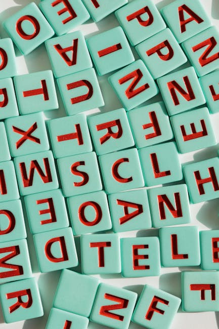 Tessere con lettere per imparare l'inglese giocando, corsi pomeridiani per bambini e sviluppo linguistico divertente.