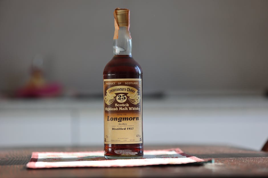 Bottiglia di whisky Longmorn vintage, distillato nel 1957, simbolo del consumo di alcol tra i giovani e responsabilità degli adulti