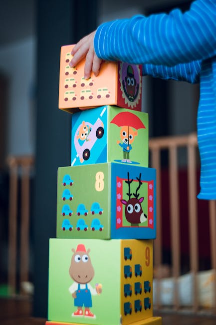 Torre di cubi colorati con animali e numeri, gioco educativo per bambini che stimola l'apprendimento musicale e la creatività.
