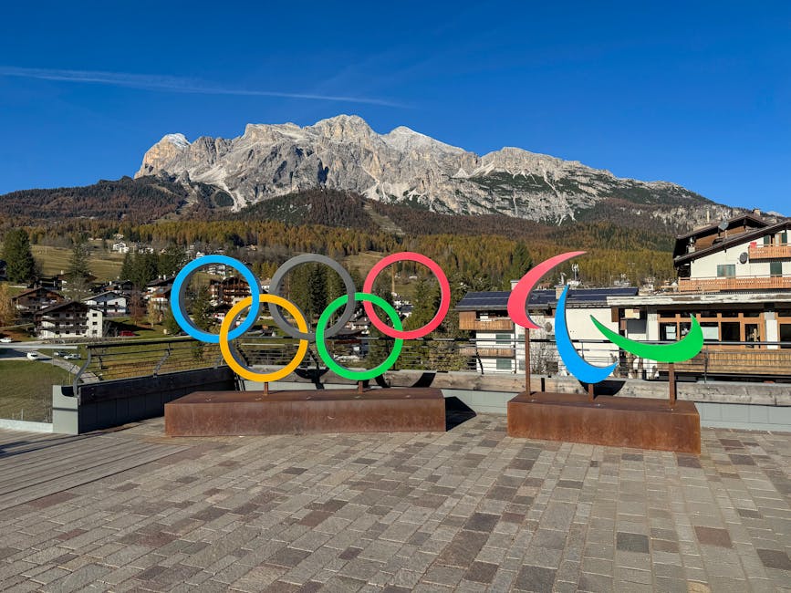 Anelli olimpici e paralimpici a Cortina d'Ampezzo con le Dolomiti sullo sfondo, scuole chiuse per Milano Cortina 2026 dal 10 al 12 febbraio.