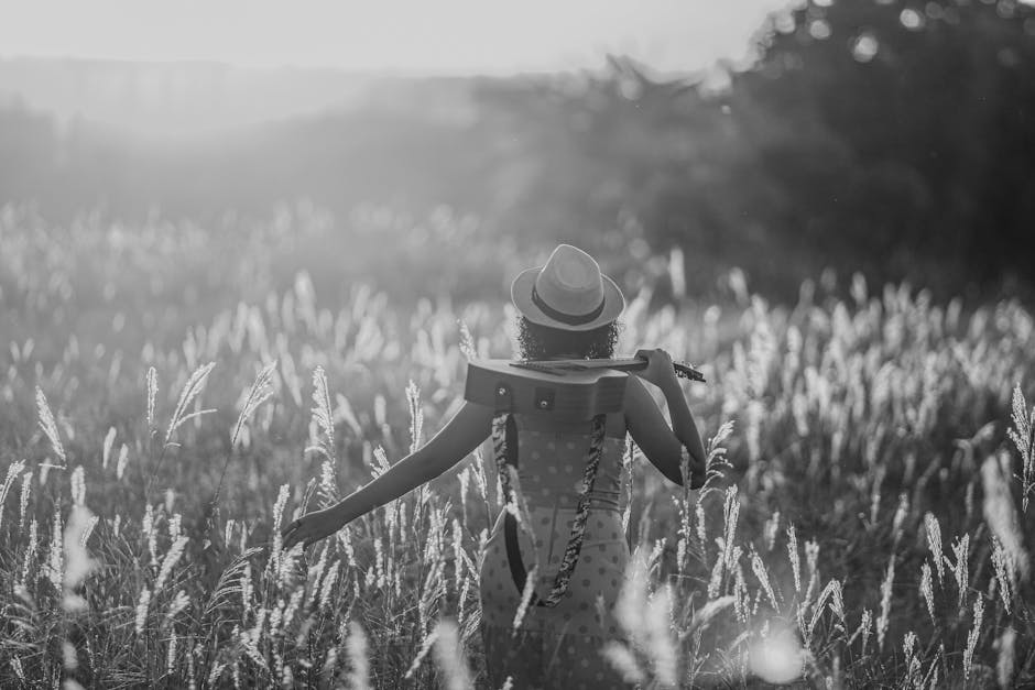 Donna con chitarra in campo di grano, immagine evocativa per Adone Canto IV: Parafrasi e Interpretazioni, natura e musica