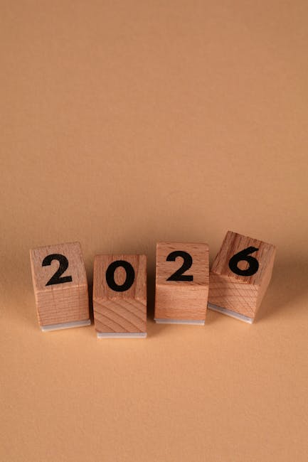 Blocchi di legno con il numero 2026 che simboleggiano il futuro del GPS e le implicazioni delle scelte lavorative nel settore scolastico.