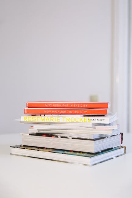 Pila di libri e riviste che simboleggiano l'apprendimento e la gamification nell'educazione, studi di caso e risultati positivi.