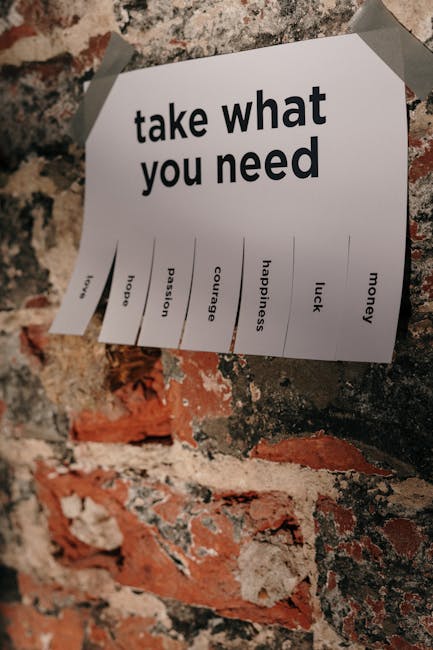 Avviso Take what you need con amore speranza passione coraggio felicità fortuna denaro su muro di mattoni per supporto psicologico ATA