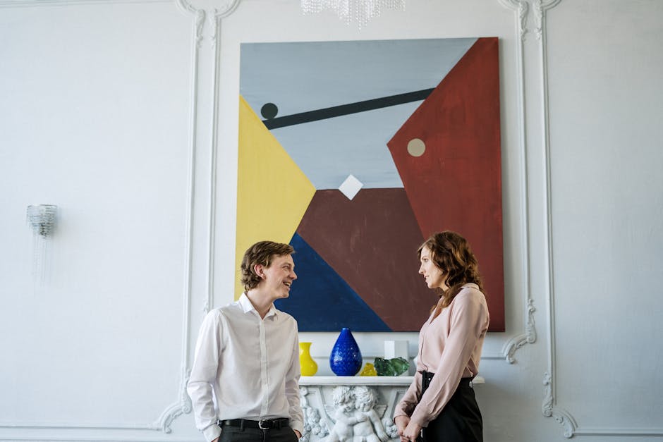 Discussione tra uomo e donna in un ambiente domestico elegante, interpretazione del significato di 'A da' nei contesti contemporanei.