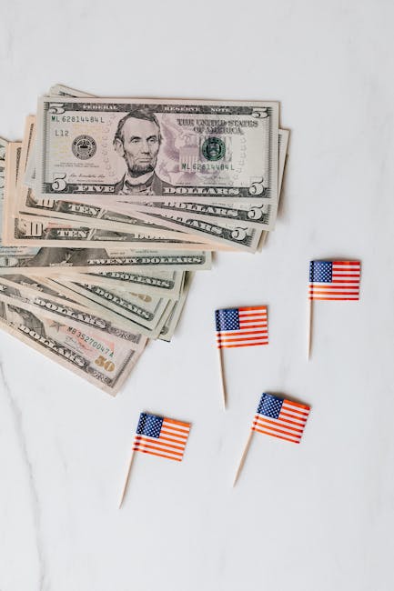 Capitalizzazione esponenziale: banconote americane e bandierine USA che simboleggiano la crescita degli investimenti negli Stati Uniti.
