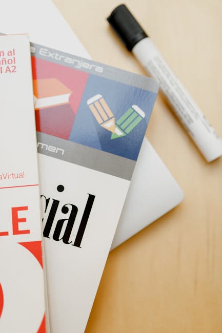 Materiale didattico per l'insegnamento delle lingue straniere: libro di testo, pennarello e risorse visive per l'apprendimento efficace.