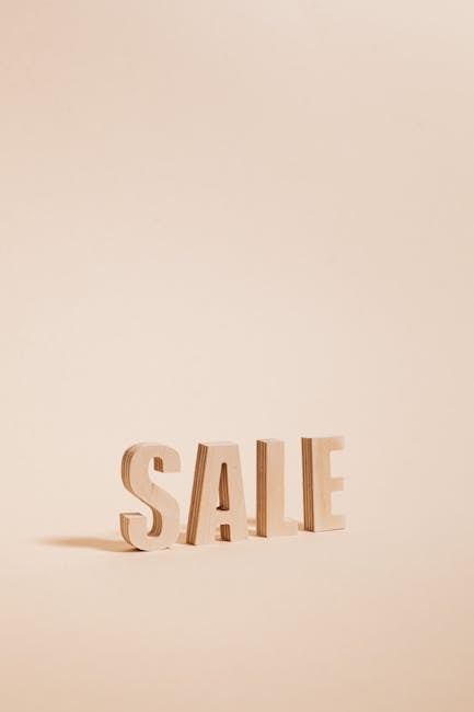 Calcolo sconto: lettere di legno SALE per illustrare l'articolo su come calcolare sconti in modo semplice ed efficace.