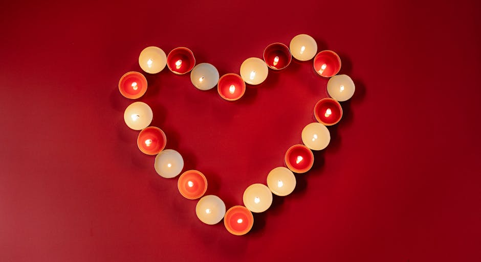 Candele a forma di cuore su sfondo rosso: metafora per bruciare calorie con amore e passione, camminando per la salute.