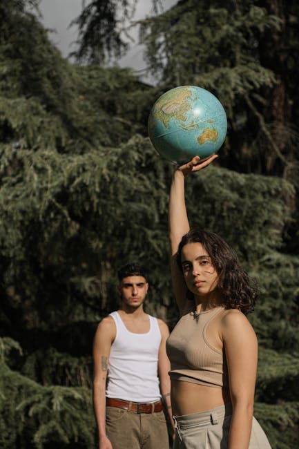 Giovani leader con globo terrestre, simbolo di responsabilità globale e ispirazione per il futuro cambiamento positivo.