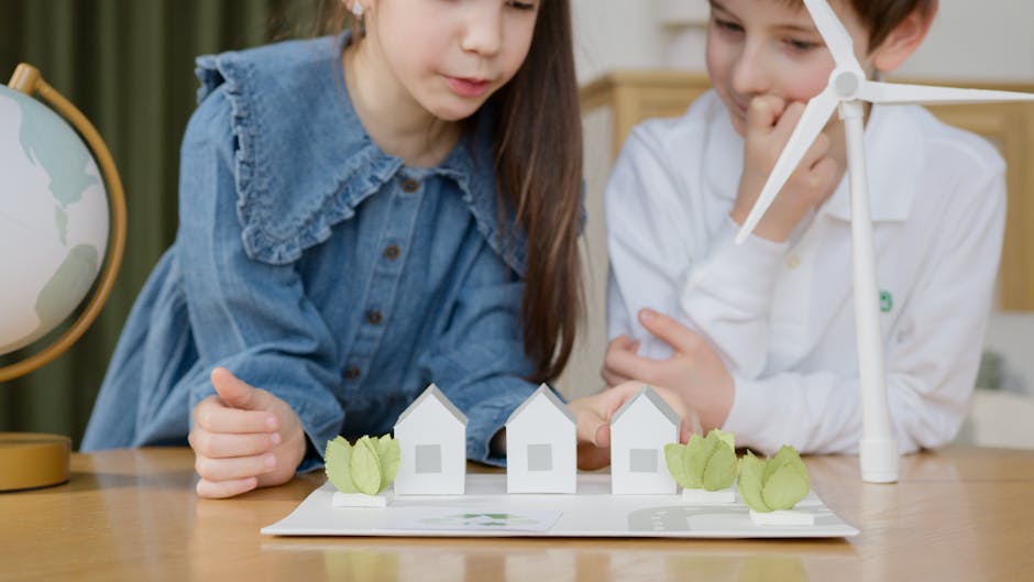Bambini che studiano modellino di case eolico: apprendimento attivo e sostenibilità ambientale per un futuro green