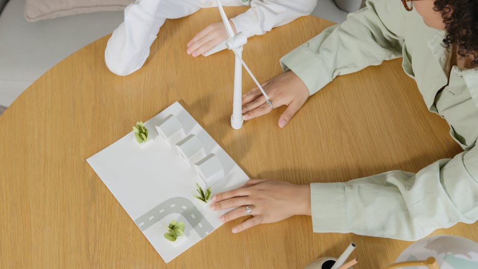 Progetto scolastico città intelligente: modellino con case, strada, eolico per un futuro sostenibile realizzato da studenti
