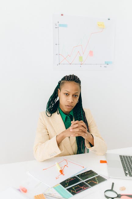 Donna che analizza dati e grafici per decisioni strategiche e innovazione aziendale, focus sulla raccolta dati.