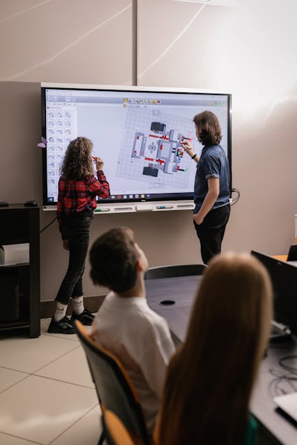 Studenti che interagiscono con una lavagna interattiva durante una lezione STEM, riflettendo le sfide dell'istruzione in Italia secondo ISTAT 2024.