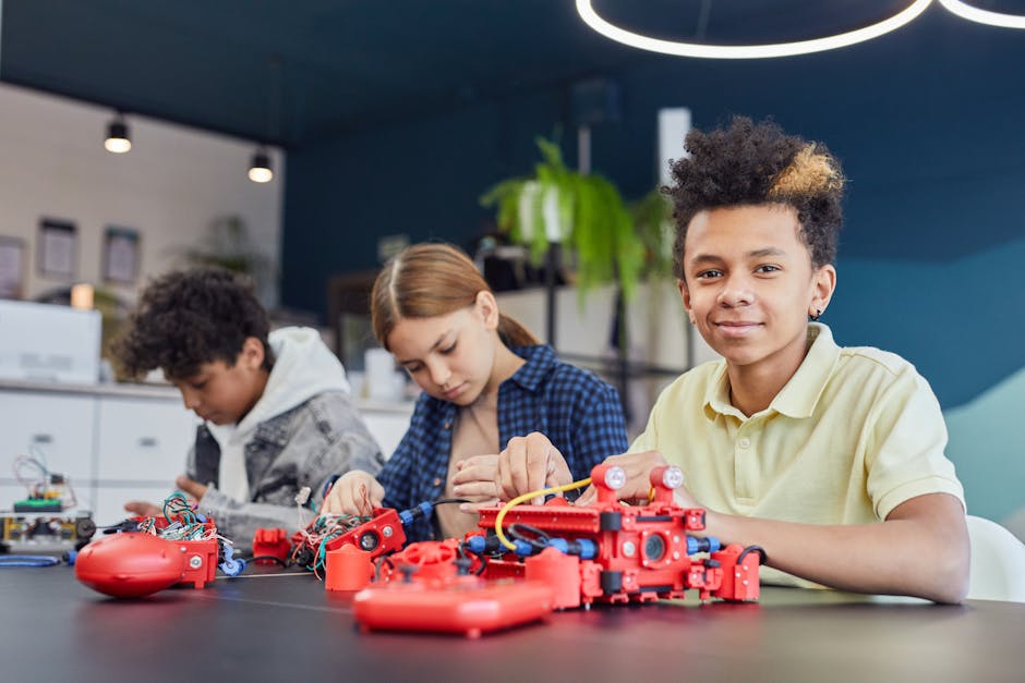 Studenti che collaborano a un progetto di robotica educativa, promuovendo l'inclusione e l'innovazione tecnologica nella didattica moderna.
