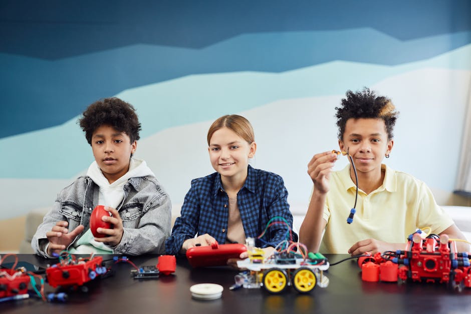 Studenti impegnati in attività didattiche STEM con robotica educativa, risorse per la scuola promosse dall'Accademia della Crusca.