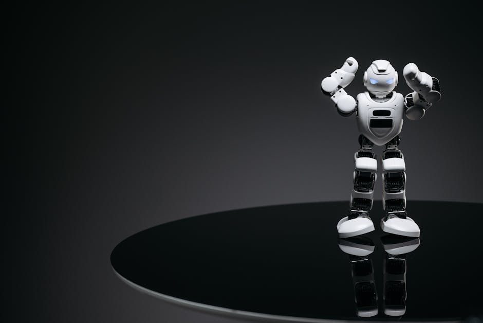 Robot bianco su sfondo scuro, simbolo dell'Intelligenza Artificiale in Francia e del congresso nazionale con Luc Ferry.