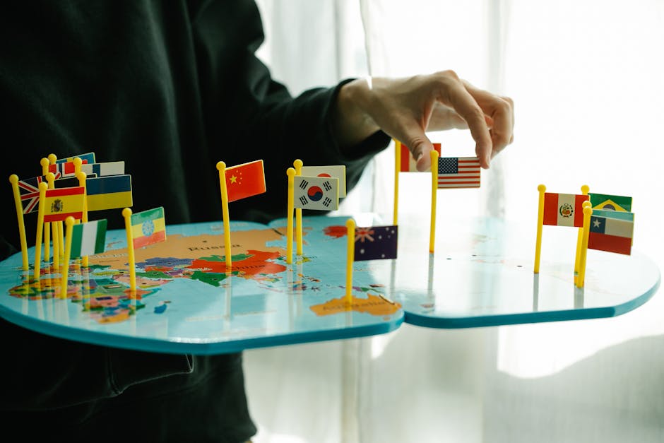 Mappa del mondo con bandiere di diverse nazioni, simbolo di interconnessione globale e cittadinanza mondiale