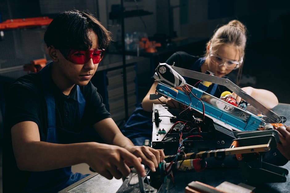 Studenti che collaborano alla costruzione di un robot, esempio di apprendimento STEM con intelligenza artificiale applicata all'istruzione
