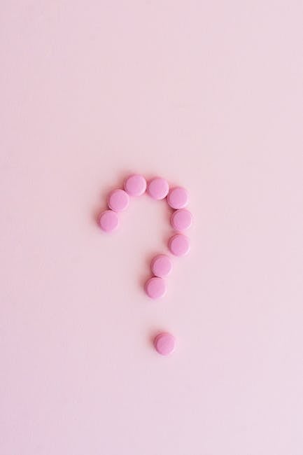 Punto interrogativo formato da pillole rosa su sfondo rosa per Question Time e legge 68/99