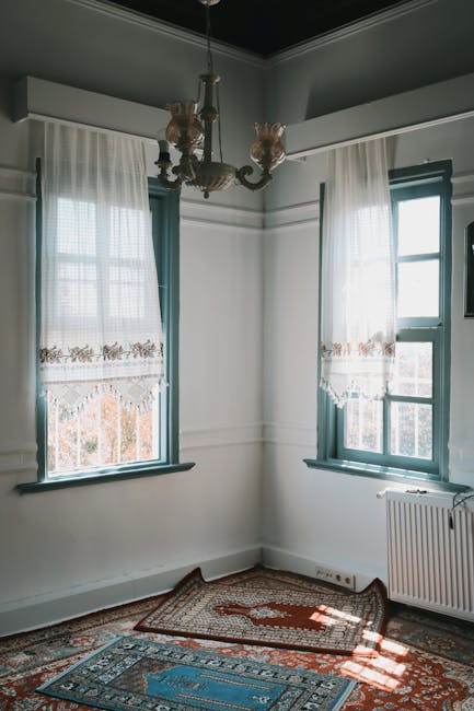 Angoli adiacenti formati da finestre e tappeti in una stanza luminosa, illustrando concetti geometrici in architettura.